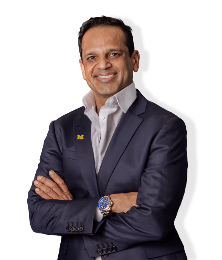 Confident man in suit with arms crossed