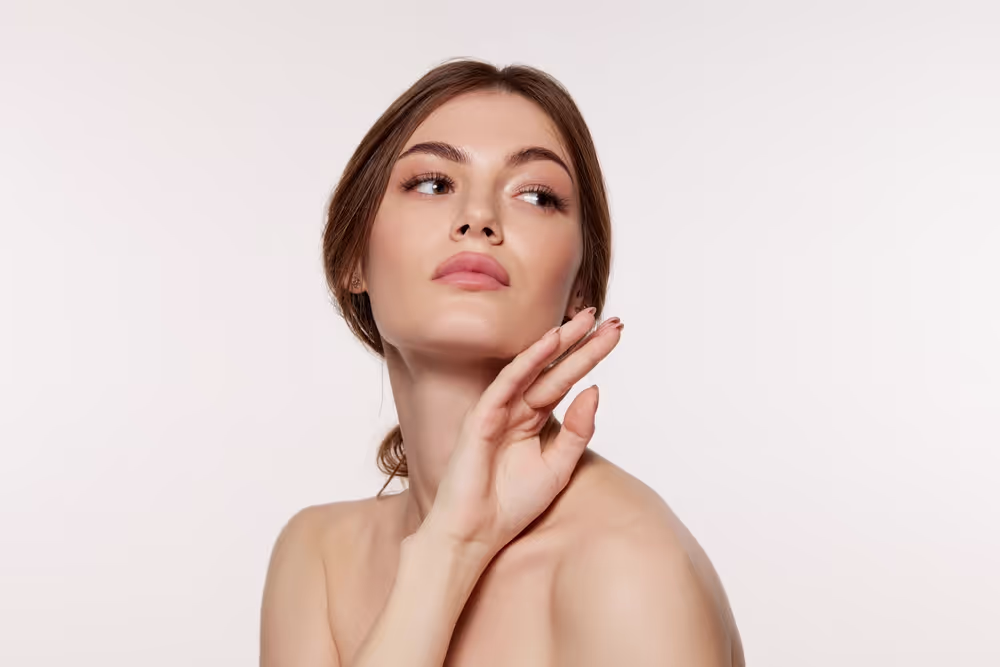 Woman posing with hand raised gracefully