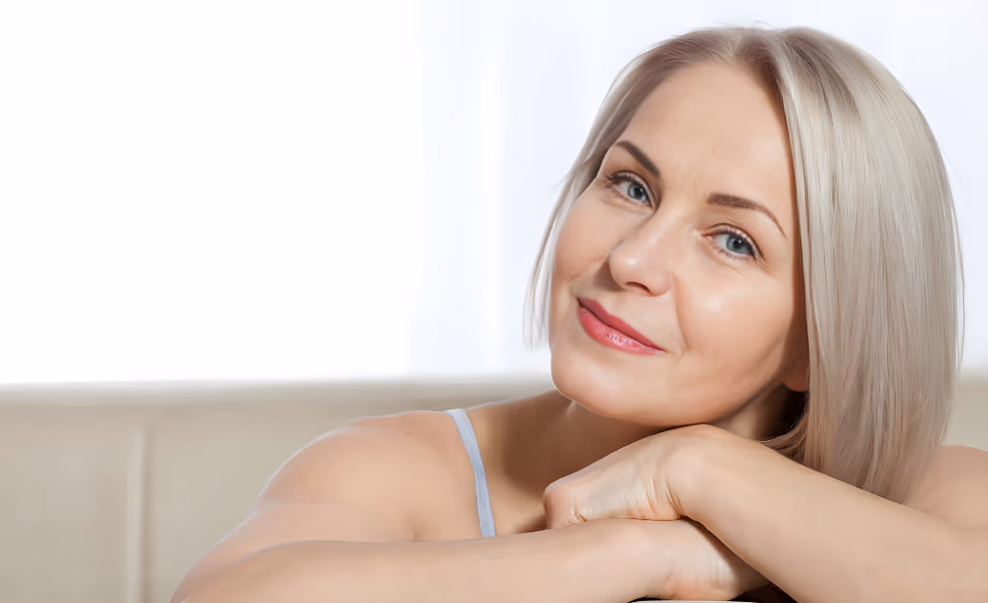 Confident woman posing with hand on chin