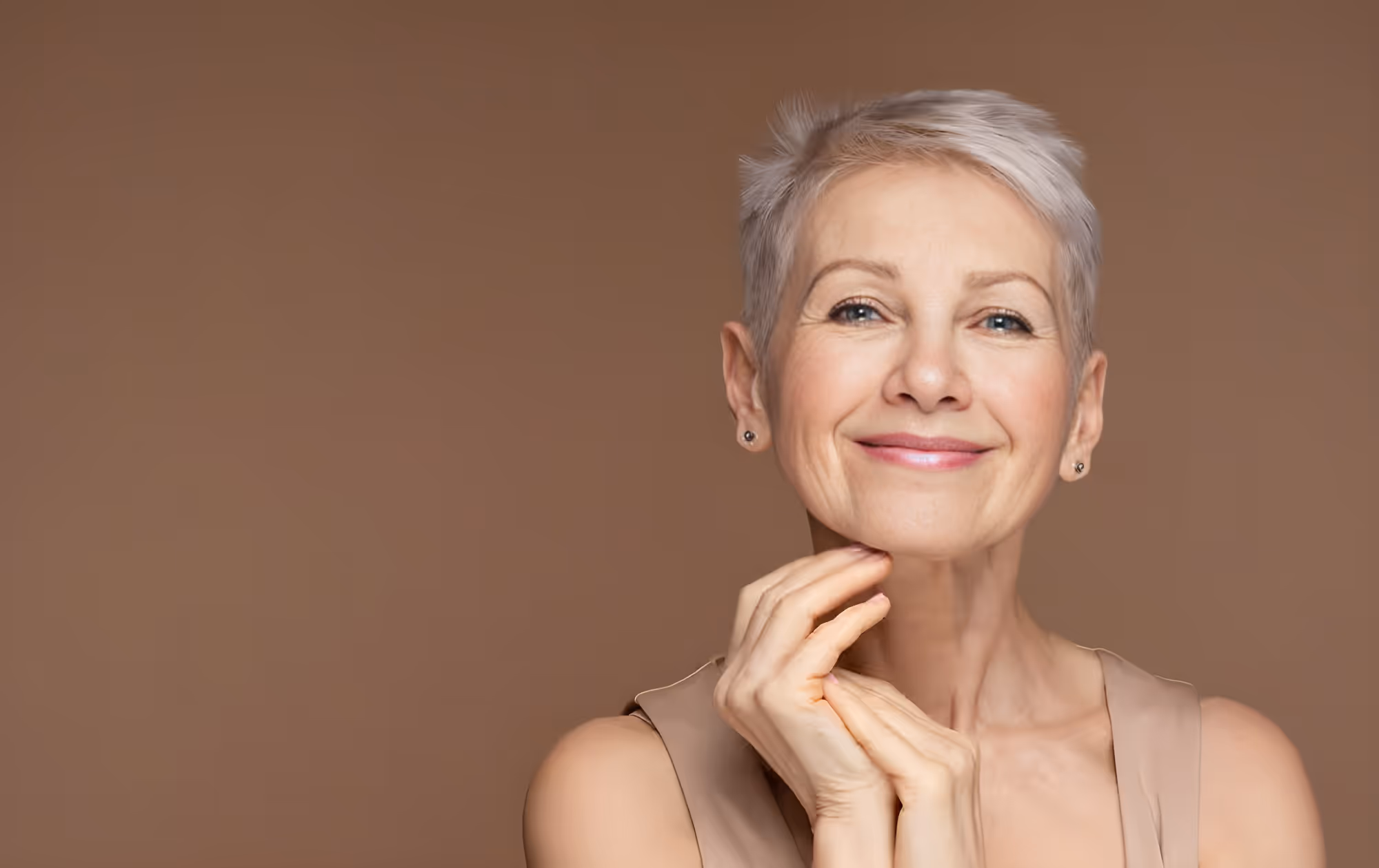 Elegant older woman smiling at camera